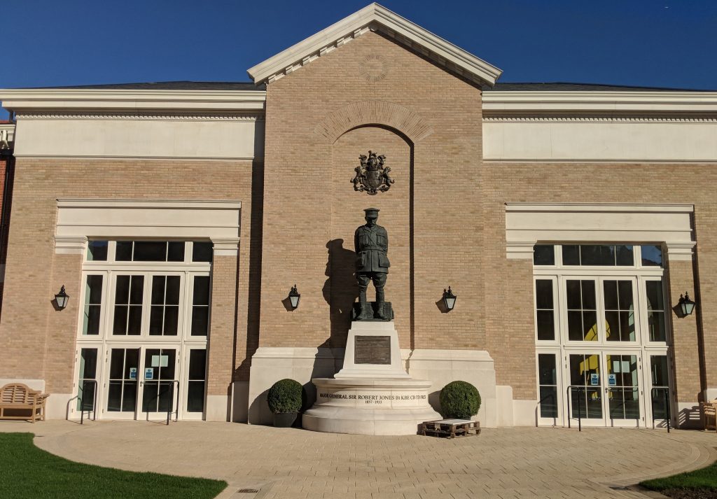 Statue of Sir Robert Jones and the front of a building in Stanford Hall